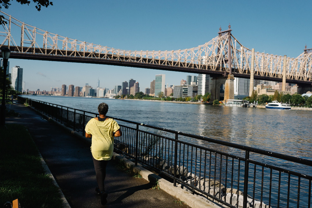 Runner training beside the East River in New York City